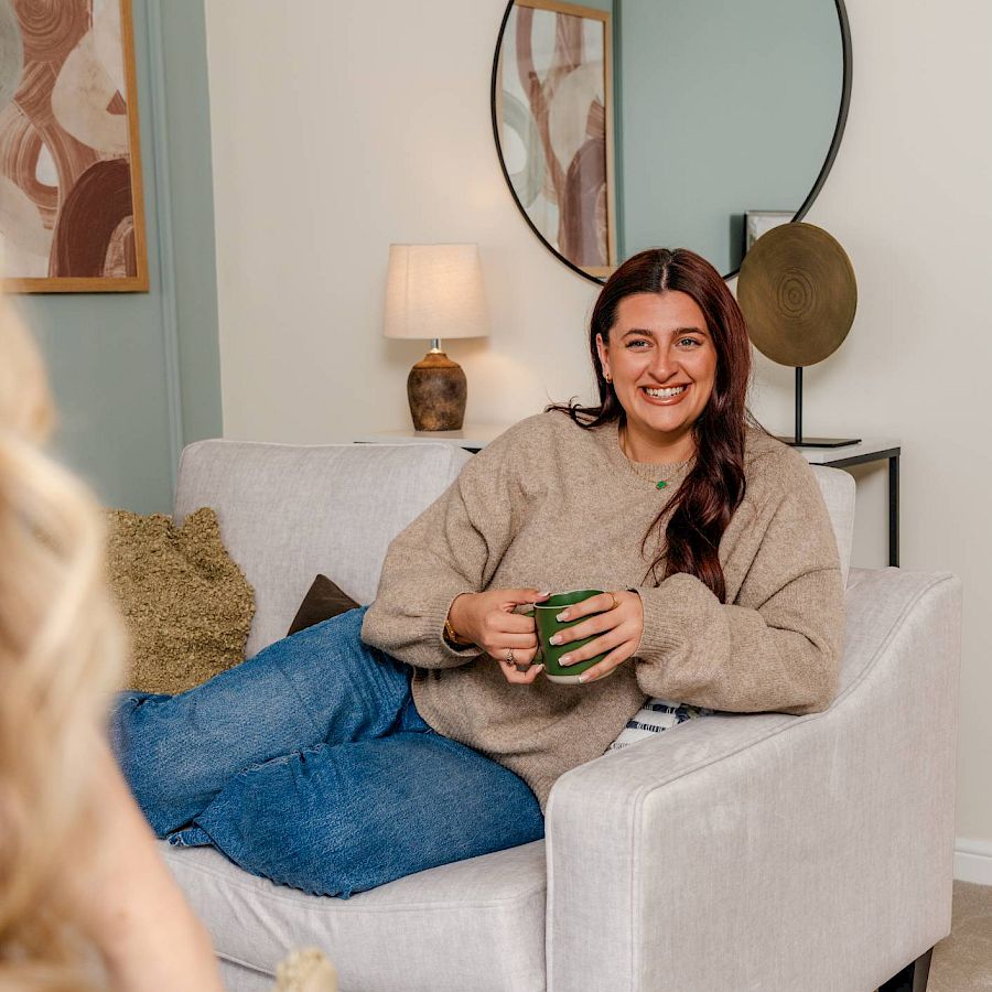 Mum and daughter running into house from garden smiling