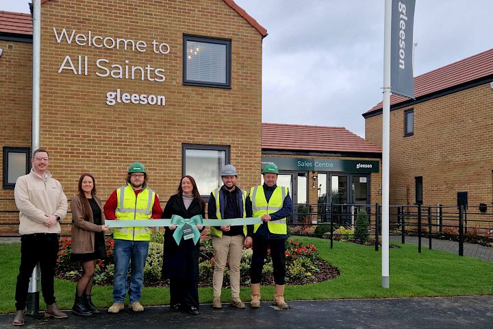 Gleeson colleagues cutting the ribbon outside show homes and sales centre