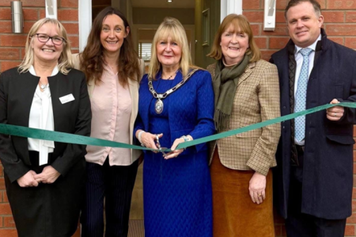 Local Councillor Jan Whitbourn cutting the ribbon at Saddler Fields show home opening