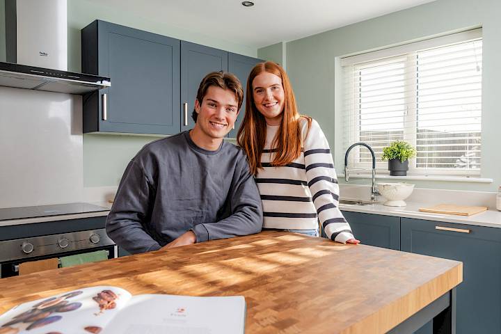 First-time buyer couple in the kitchen